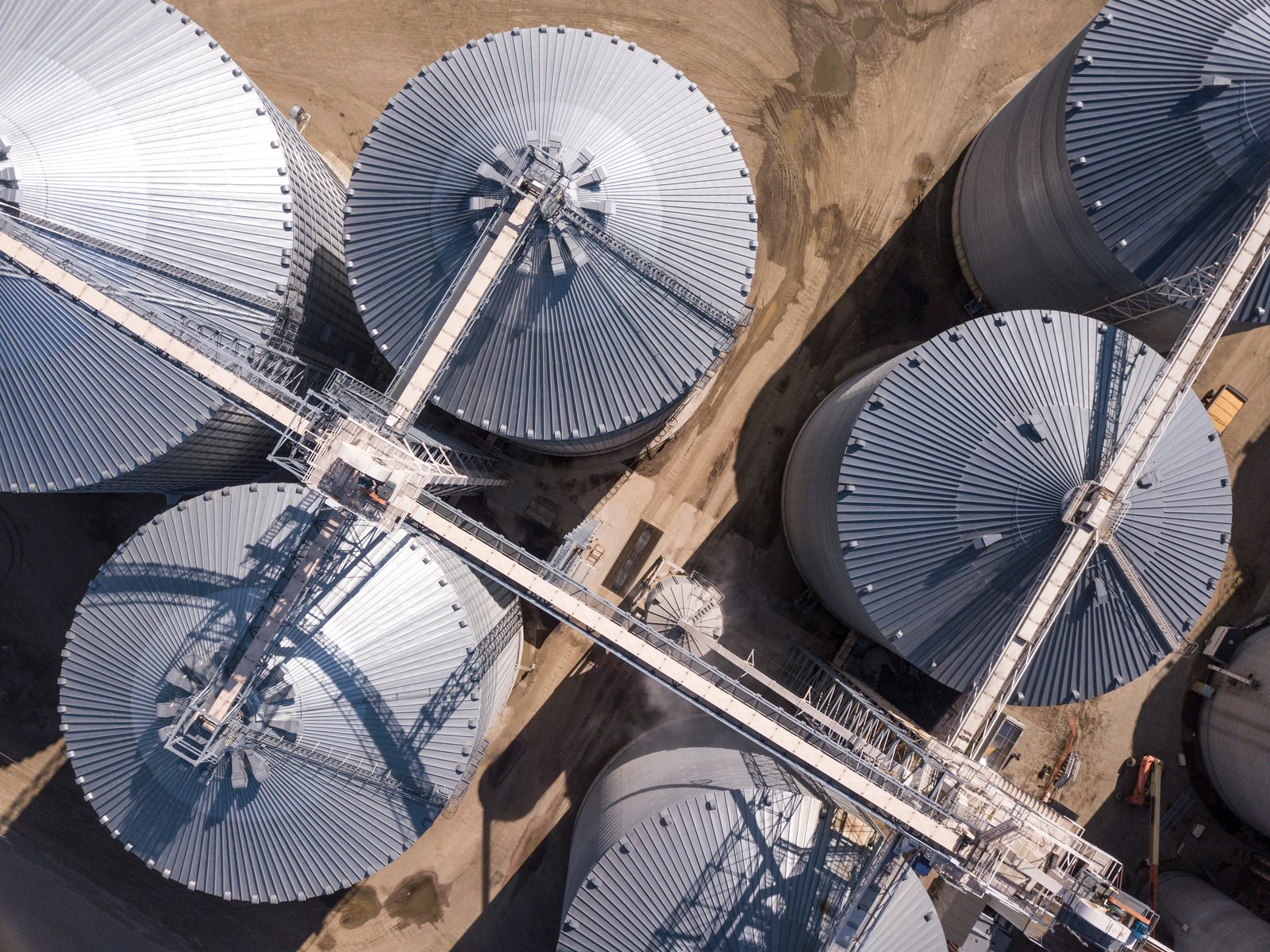 Aerial view of grain storage bins and conveyor systems